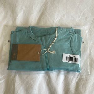 Kyte baby zip romper in sea foam